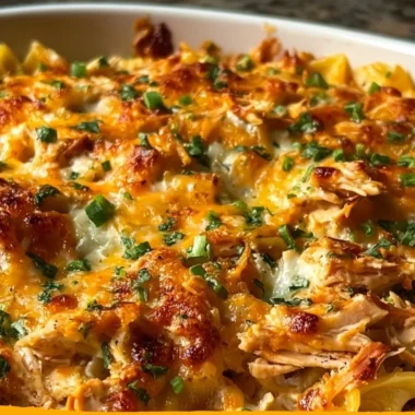 BBQ Ranch Chicken Casserole topped with cheese and herbs served in a baking dish