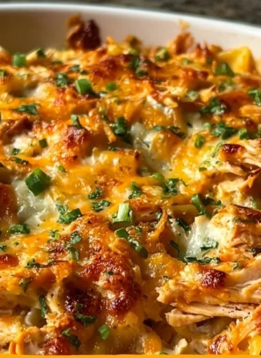 BBQ Ranch Chicken Casserole topped with cheese and herbs served in a baking dish