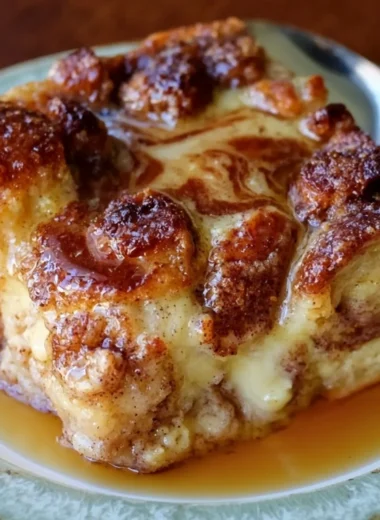 Delicious Pioneer Woman French toast casserole topped with syrup and berries