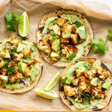 Delicious cauliflower tacos topped with creamy avocado sauce.