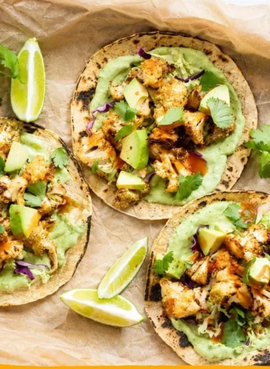 Delicious cauliflower tacos topped with creamy avocado sauce.