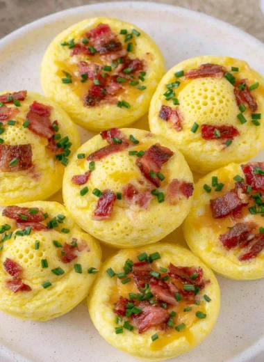 Plate of fluffy cottage cheese egg bites garnished with herbs