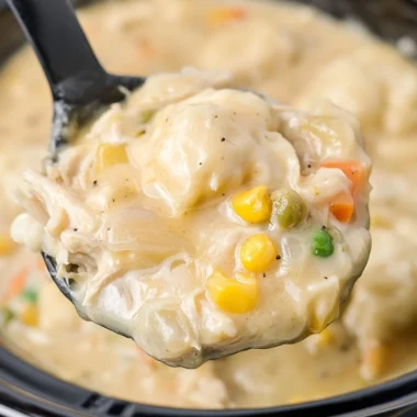 Crock Pot chicken and dumplings with biscuits, a comforting dinner recipe.