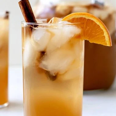 Bowl of colorful fall harvest punch with fruits and spices
