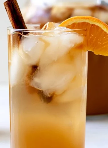 Bowl of colorful fall harvest punch with fruits and spices