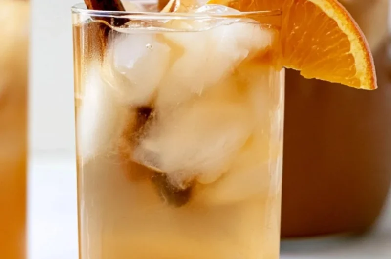 Bowl of colorful fall harvest punch with fruits and spices