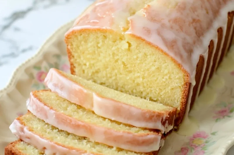Gluten-free lemon loaf with sweet glaze on a wooden table