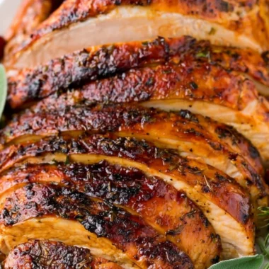 Oven roasted turkey breast garnished with herbs and spices