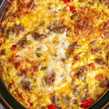 Overnight crockpot breakfast casserole with eggs, cheese, and veggies