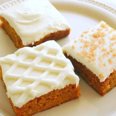 Delicious pumpkin bars topped with creamy frosting, perfect for fall desserts.