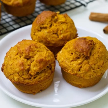 Delicious homemade pumpkin oatmeal muffins on a wooden table