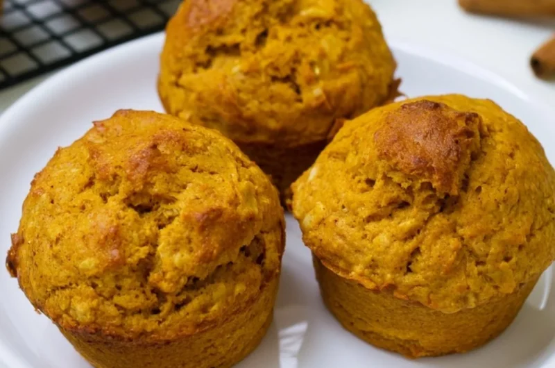 Delicious homemade pumpkin oatmeal muffins on a wooden table
