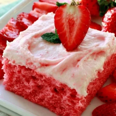 Deliciously moist Strawberry Texas Sheet Cake with fresh strawberries and creamy frosting