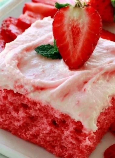 Deliciously moist Strawberry Texas Sheet Cake with fresh strawberries and creamy frosting