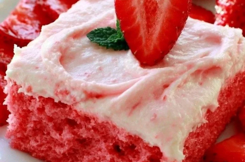 Deliciously moist Strawberry Texas Sheet Cake with fresh strawberries and creamy frosting