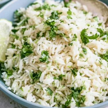 Bowl of cilantro lime rice, a Chipotle copycat recipe, garnished with fresh cilantro