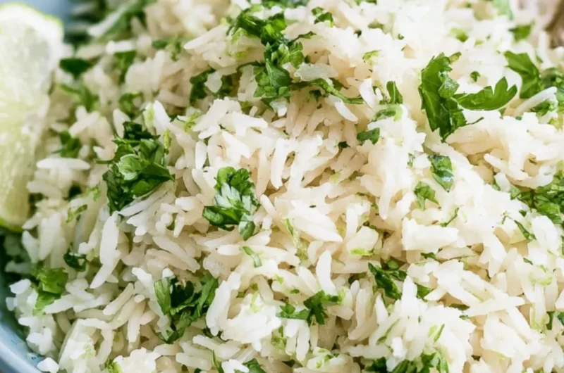 Bowl of cilantro lime rice, a Chipotle copycat recipe, garnished with fresh cilantro