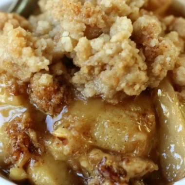 Delicious Apple Pear Walnut Crisp topped with crunchy walnuts and fresh fruit.