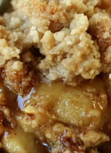 Delicious Apple Pear Walnut Crisp topped with crunchy walnuts and fresh fruit.