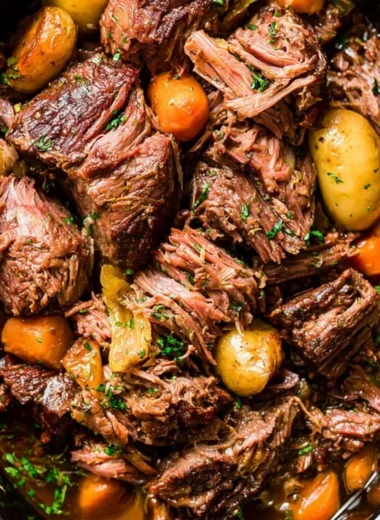 Delicious Crock Pot Chuck Roast cooked to perfection with herbs and spices