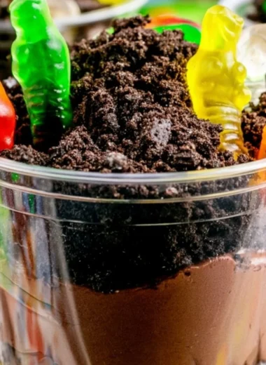 Delicious dirt cups dessert with chocolate pudding and gummy worms