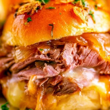Delicious French Dip Sliders served with dipping sauce