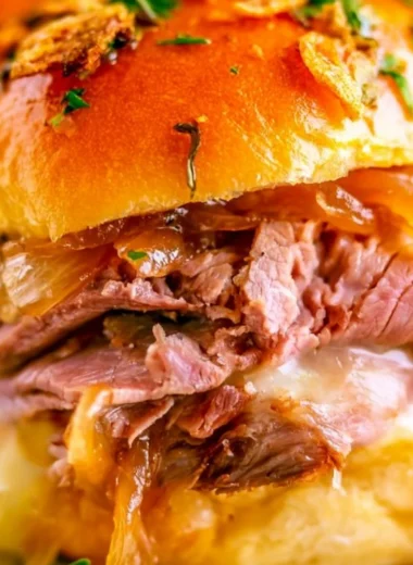 Delicious French Dip Sliders served with dipping sauce