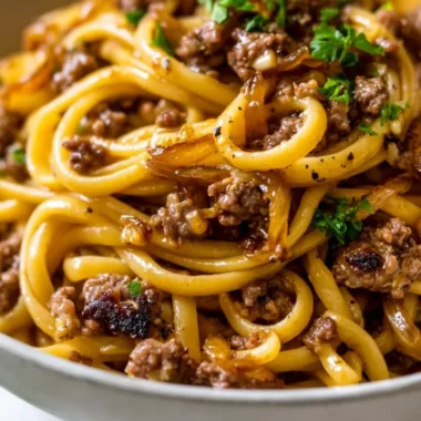 Delicious Garlic Butter Beef Pasta garnished with parsley in a bowl