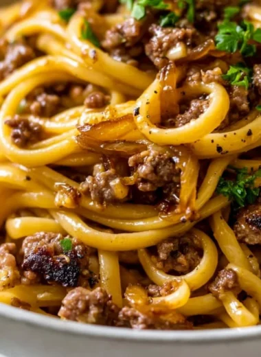 Delicious Garlic Butter Beef Pasta garnished with parsley in a bowl