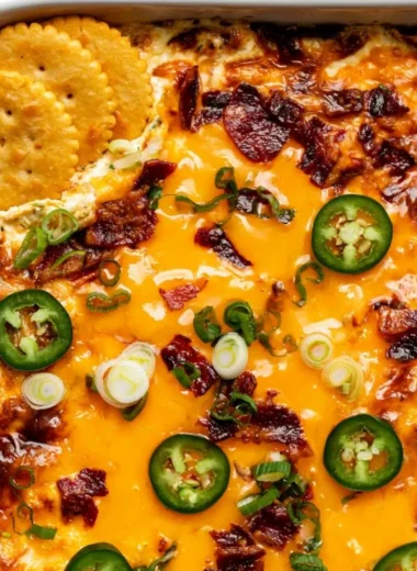 Delicious Jalapeno Popper Dip served in a bowl with a spoon
