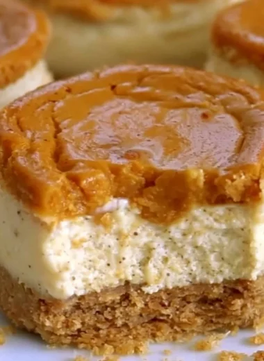 Delicious mini pumpkin cheesecakes served in cute cupcake liners.