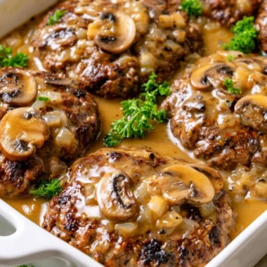 Serving of Poor Man’s Steak with sides on a plate, showcasing budget-friendly cooking.