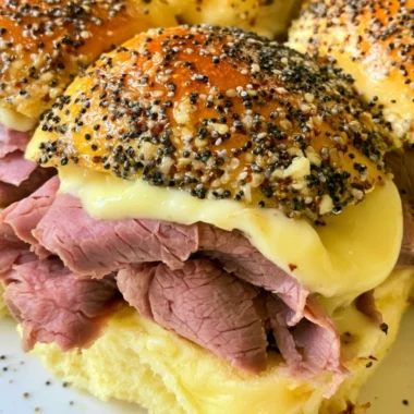 Delicious roast beef sliders on a platter, perfect for parties and gatherings.