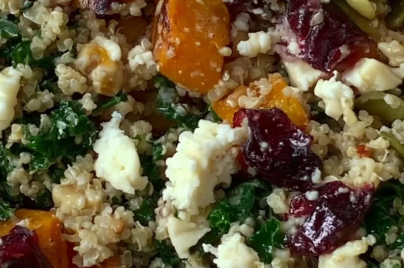 Delicious warm harvest quinoa bowl with seasonal vegetables and herbs