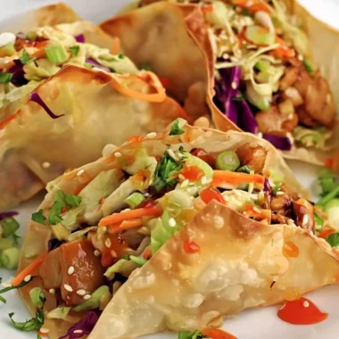 Crispy chicken wonton tacos served with fresh toppings.