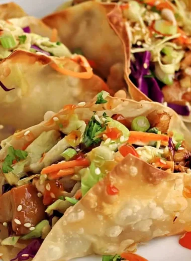 Crispy chicken wonton tacos served with fresh toppings.
