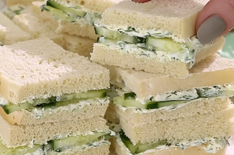Delicious cucumber sandwiches served on a platter for afternoon tea.