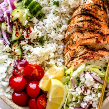 Delicious Greek Chicken Bowl with fresh vegetables and tzatziki sauce