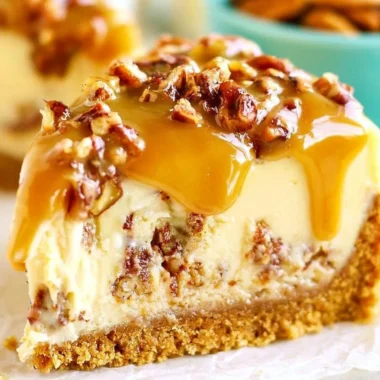 Delicious Pecan Praline Cheesecake topped with caramelized pecans