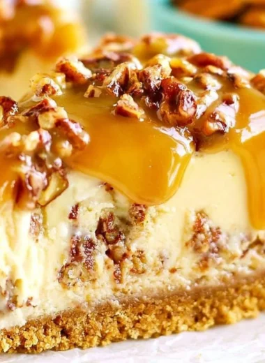 Delicious Pecan Praline Cheesecake topped with caramelized pecans