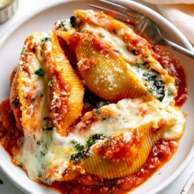 Delicious stuffed shells filled with ricotta cheese and herbs topped with marinara sauce
