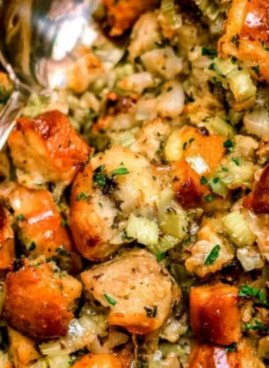 Traditional Thanksgiving stuffing recipe with savory ingredients and herbs.
