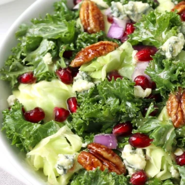 Winter chopped salad with pomegranate, blue cheese, and fresh greens for festive meals