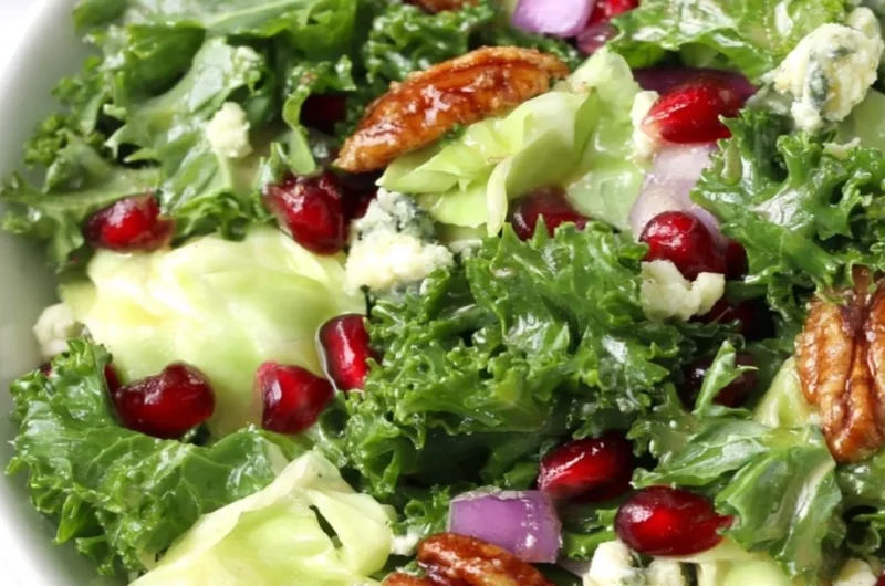 Winter chopped salad with pomegranate, blue cheese, and fresh greens for festive meals